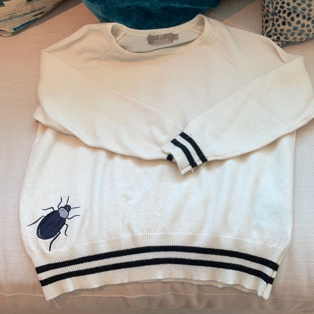 Ivory cashmere sweater with embroidered bug